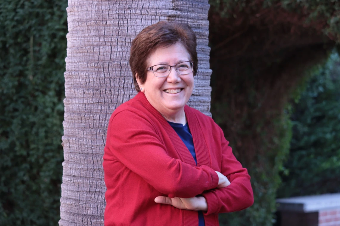 Sharon B. Megdal smiling by tree