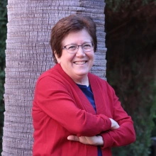 Sharon B. Megdal smiling by tree